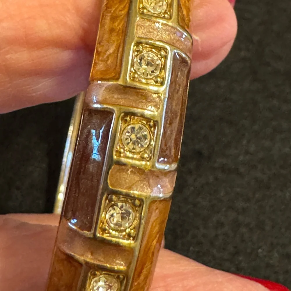 Gold tone with brown and caramel enamel hinged bracelet w/rhinestone accents